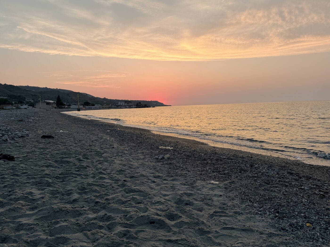 Sunset over the beach and sea at DinaBeach